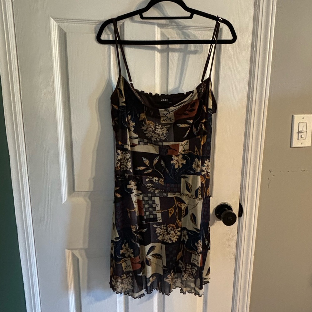 This is a brown color block mini/midi dress with adjustable straps.